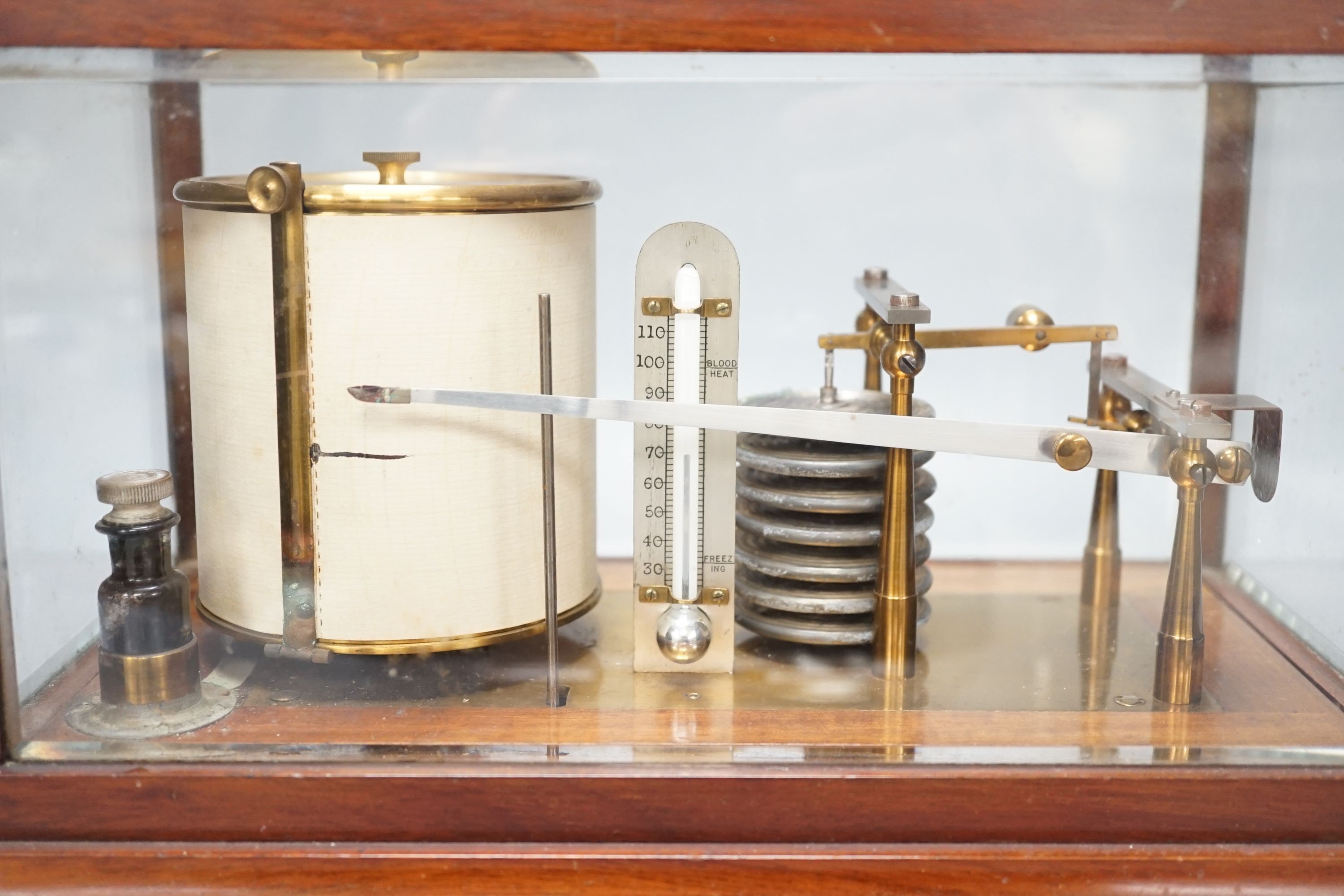 An early 20th century barograph in a mahogany case, 36 cms wide x 21cm high.